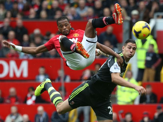 Patrice Evra and Geoff Cameron clash.