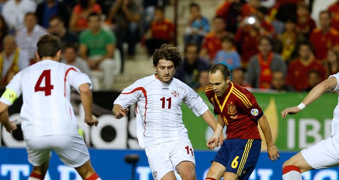 Andres Iniesta finds himself surrounded