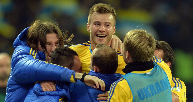 Andriy Yarmolenko: Celebrates with his team-mates as Ukraine keep their World Cup dream alive