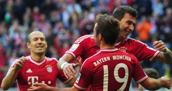 Mario Mandzukic celebrates with Mario Goetze
