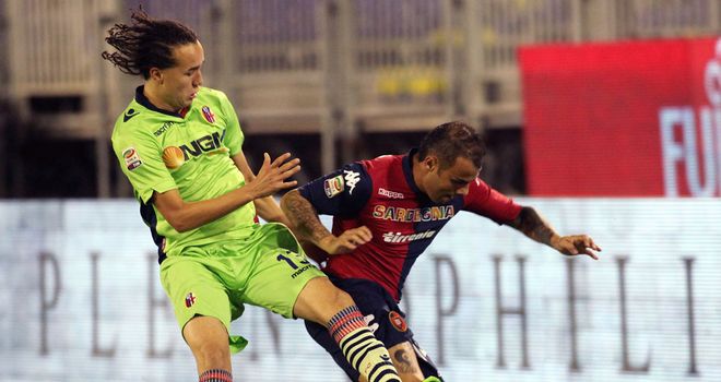 Francesco Pisano and Diego Lazalt battle for the ball