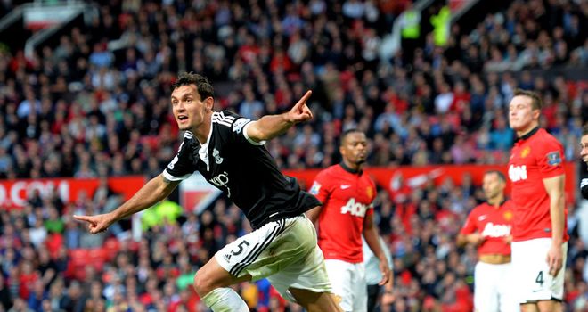 Dejan Lovren celebrates Lallana's scrambled leveller