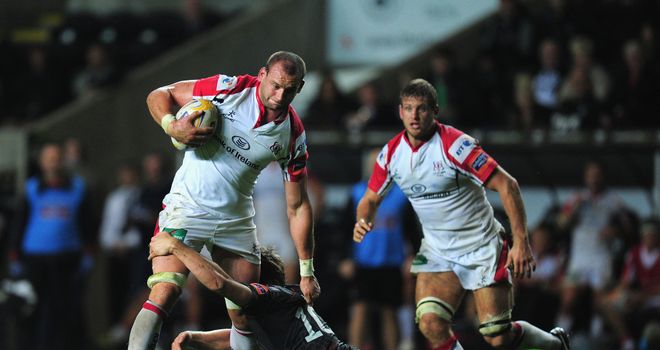 Ulster's Dan Tuohy runs through the attempted tackle of Dan Biggar