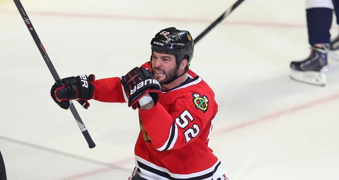 Brandon Bollig celebrates his first period goal for the Chicago Blackhawks