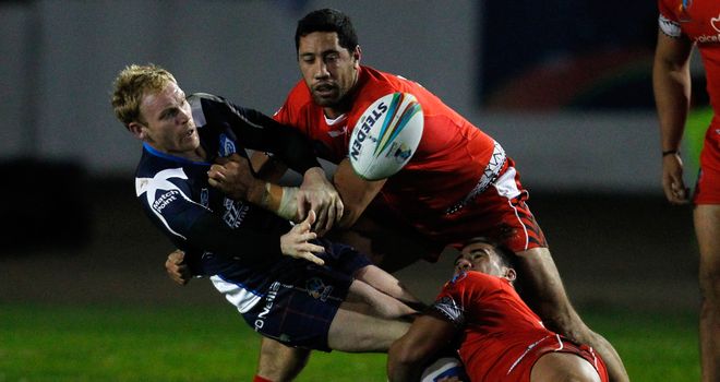 Peter Wallace: Offloads the ball during Scotland's win over Tonga in Workington