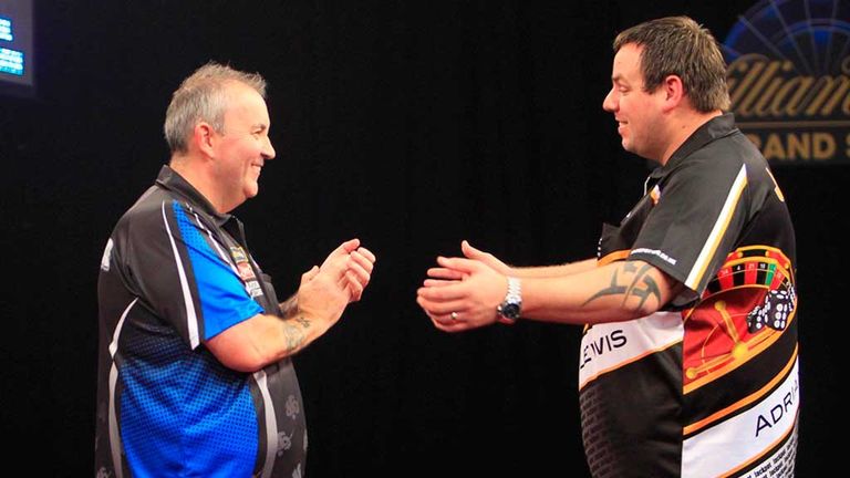 Phil Taylor and Adrian Lewis applaud each other after their epic contest