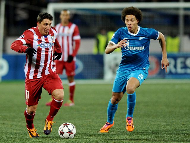 Cristian Rodriguez and Axel Witsel battle for the ball