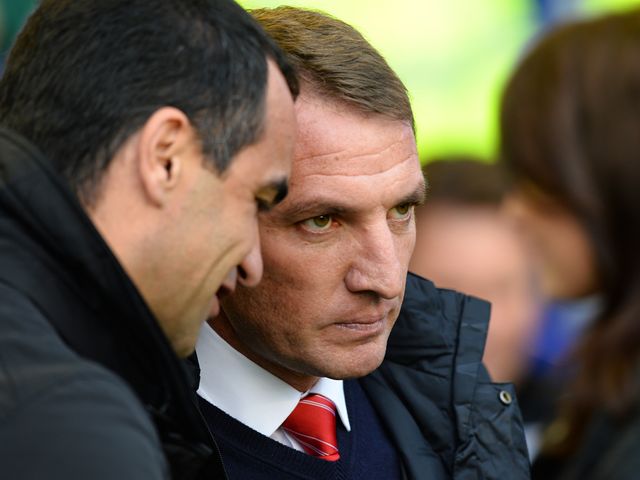 Brendan Rodgers talks with Roberto Martinez