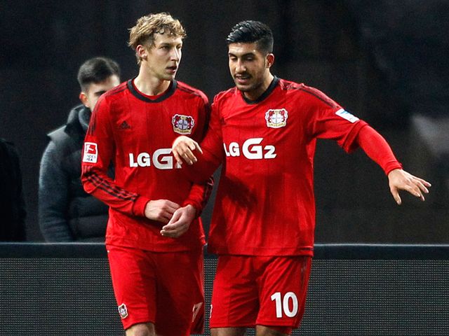 Stefan Kiessling (left) of Leverkusen celebrates with Emre Can