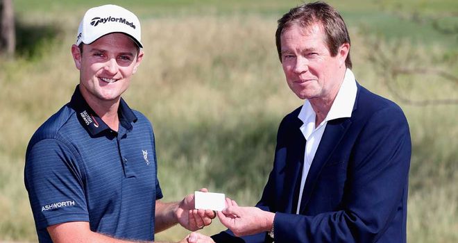 Justin Rose receives his silver membership card from chief executive George O'Grady