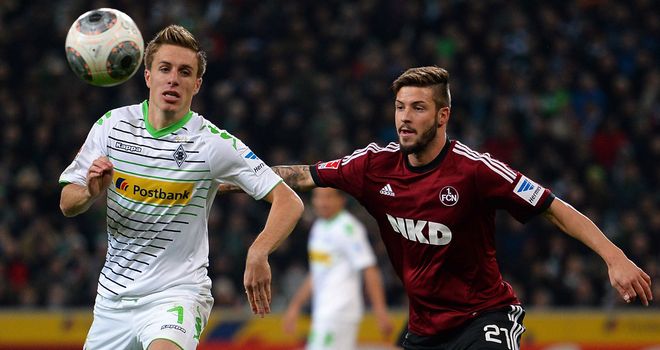 Patrick Herrmann of Moenchengladbach and Marvin Plattenhardt of Nuernberg