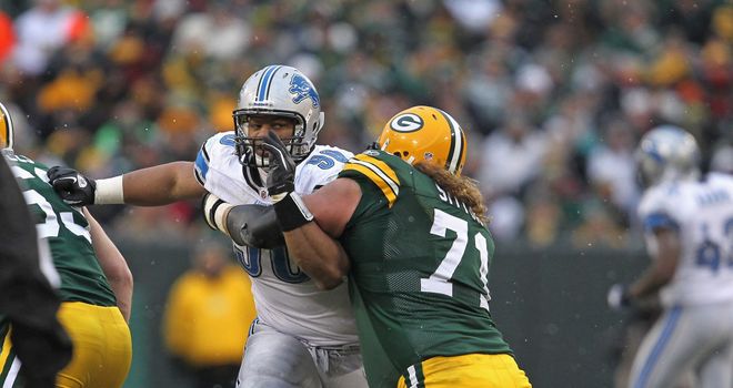 Ndamukong Suh of the Detroit Lions rushes against Josh Sitton of the Green Bay Packers at Lambeau Field