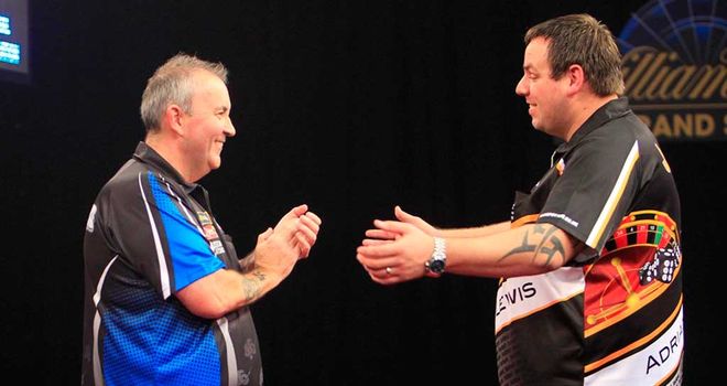 Phil Taylor and Adrian Lewis applaud each other after their epic contest