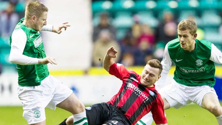 St Johnstone's Patrick Cregg (centre) goes over the top on Paul Cairney of Hibernian