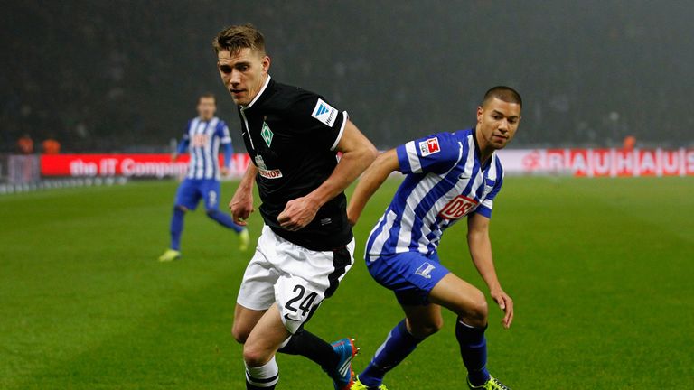 Nils Petersen and Marcel Ndjeng watch the ball
