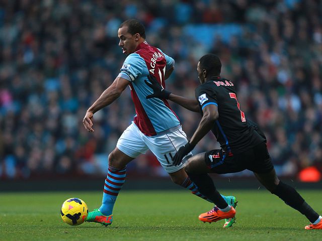 Gabriel Agbonlahor holds off Yannick Bolasie