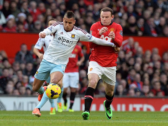 Ravel Morrison and Wayne Rooney battle for the ball