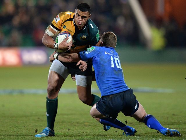 Luther Burrell is tackled by Ian Madigan.