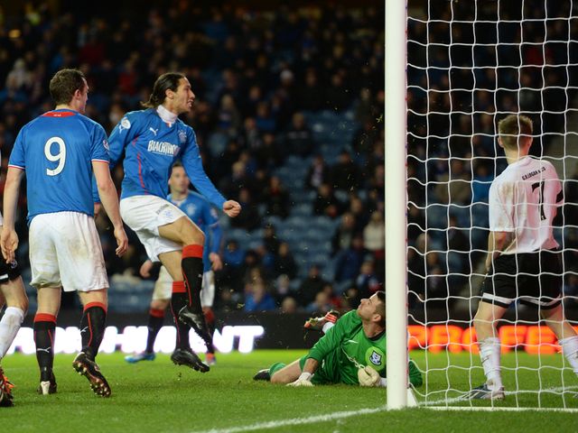 Bilel Mohsni scores to give Rangers a 3-0 lead