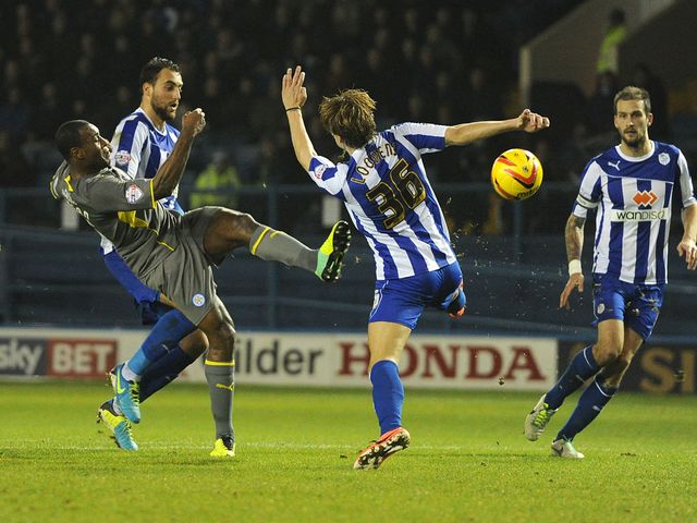 Wes Morgan has a shot on goal for Leicester