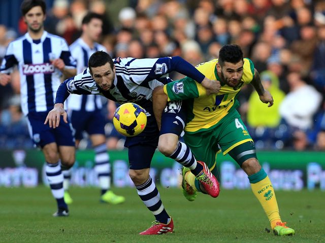 Morgan Amalfitano and Bradley Johnson battle for the ball