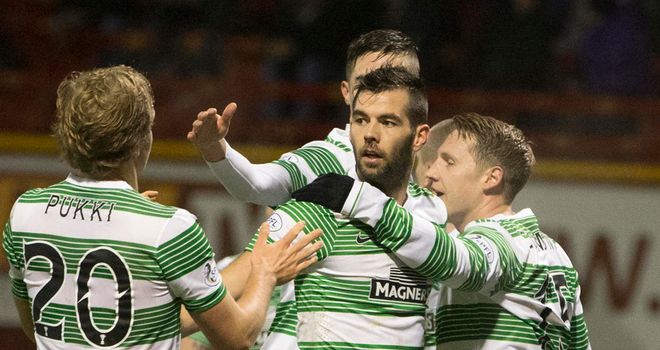 Kris Commons (right): Celebrates his first goal in the 5-0 win at Motherwell