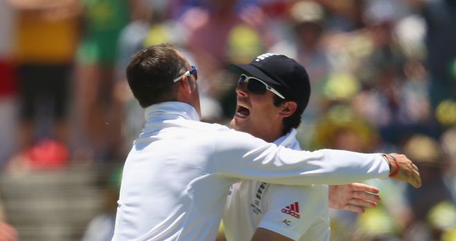 Graeme Swann and Alastair Cook celebrate the wicket of Michael Clarke in Perth