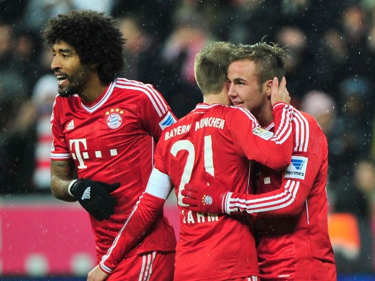 Dante, Philipp Lahm and Mario Gotze celebrate