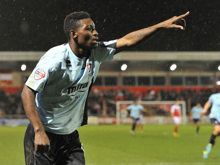 Jermaine McGlashan celebrates his goal for Cheltenham