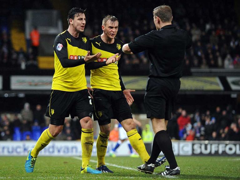 Furious Watford players protest to Graham Scott at Portman Road