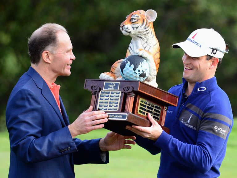 Zach Johnson receives his trophy.