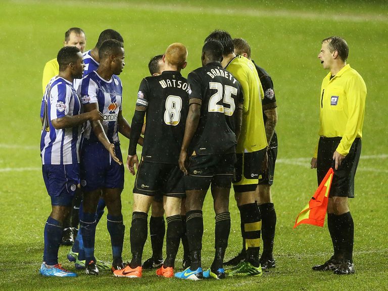 Sheffield Wednesday and Wigan players shake hands
