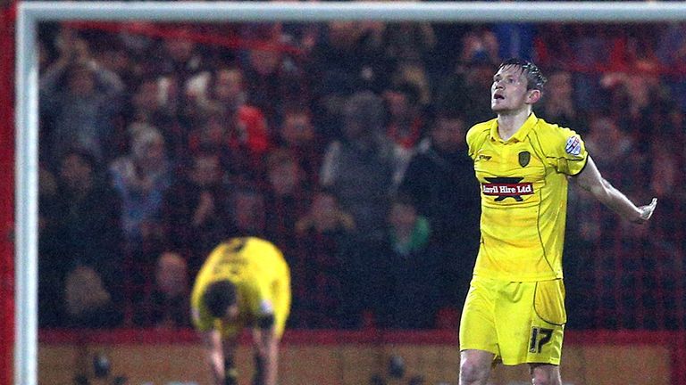 Burton goalscorer Jimmy Phillips dejected after conceding one of four Bournemouth goals