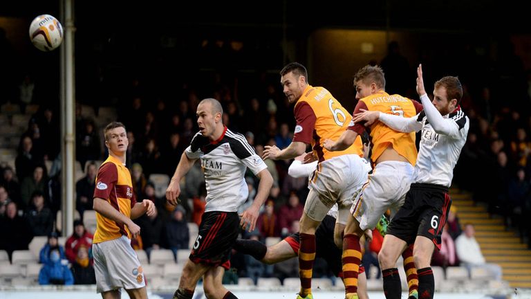 Stephen McManus heads Motherwell in front at Fir Park