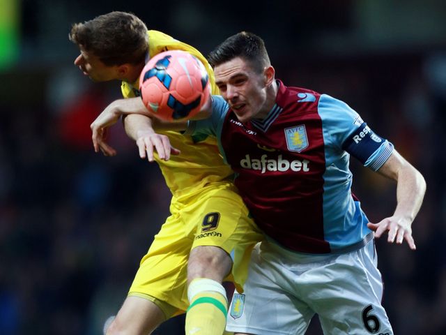Aston Villa's Ciaran Clark wins a header