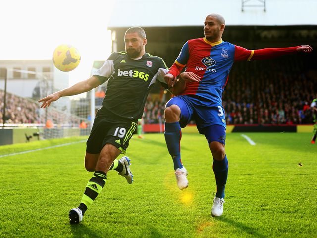 Jonathan Walters is put under pressure by Adlene Guedioura
