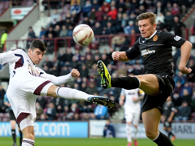 Callum Paterson battles for the ball with Shaun Hutchinson