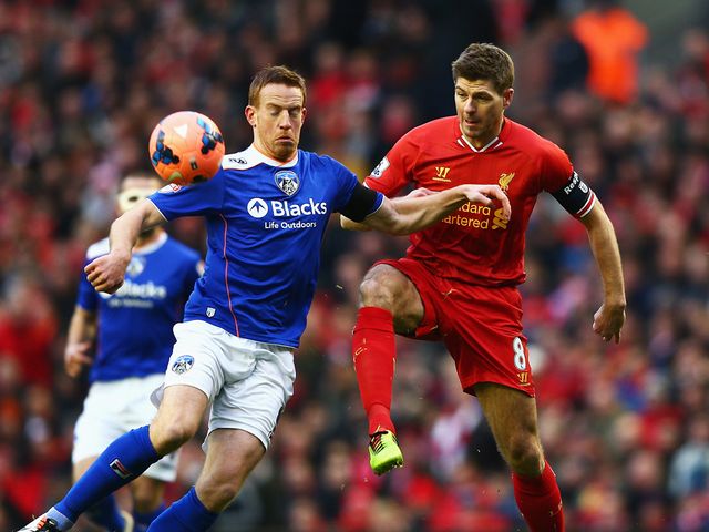 Steven Gerrard challenges Adam Rooney