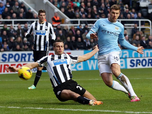 Edin Dzeko scores to give Man City the lead