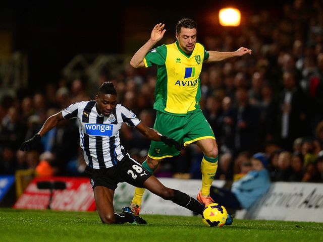 Sammy Ameobi tries to tackle Russell Martin