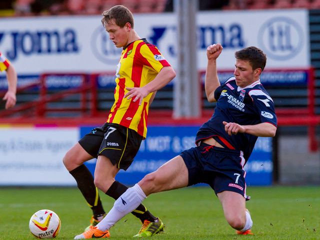 James Craigen is challenged by Filip Kiss