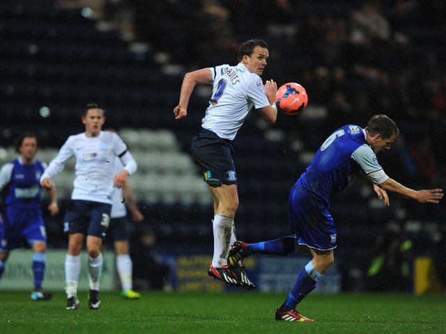 Kevin Davies looks on after winning a header
