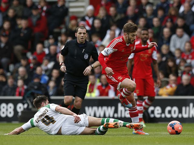 Adam Lallana skips over a tackle from Joe Edwards