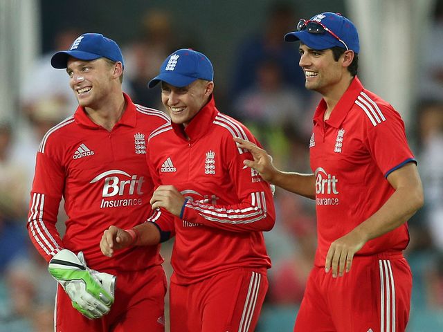 Jos Buttler celebrates with Root and Cook