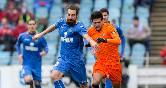 Borja and Carlos Vela battle for the ball
