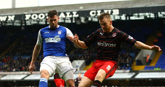 Daryl Murphy (left) and Alex Pearce: Battle for the ball at Portman Road