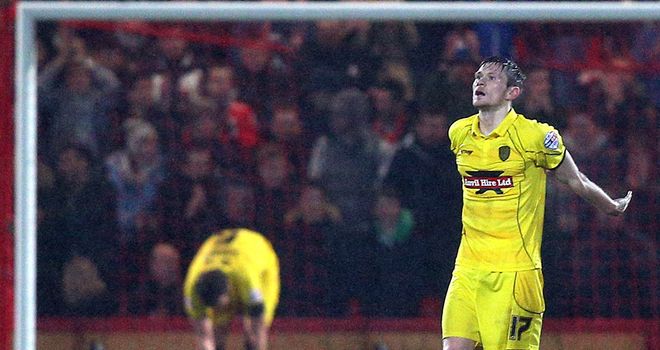 Burton goalscorer Jimmy Phillips dejected after conceding one of four Bournemouth goals