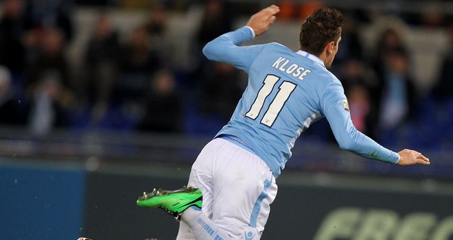 Gianluigi Buffon brings down Miroslav Klose to concede a penalty