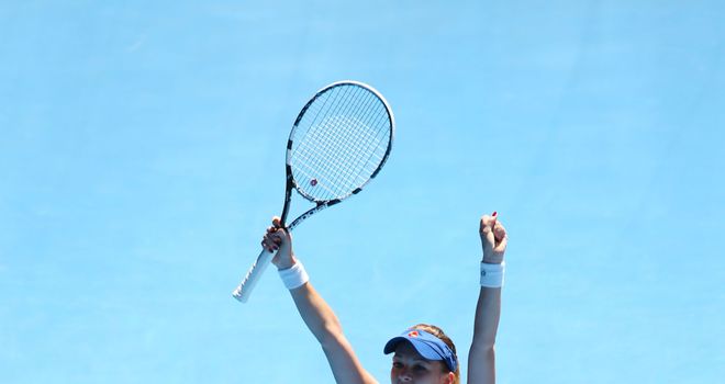 Agnieszka Radwanska celebrates beating Victoria Azarenka