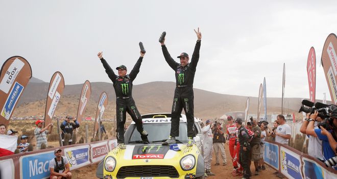 Nani Roma (R) and co-driver Michel Perin celebrate victory in the Dakar Rally